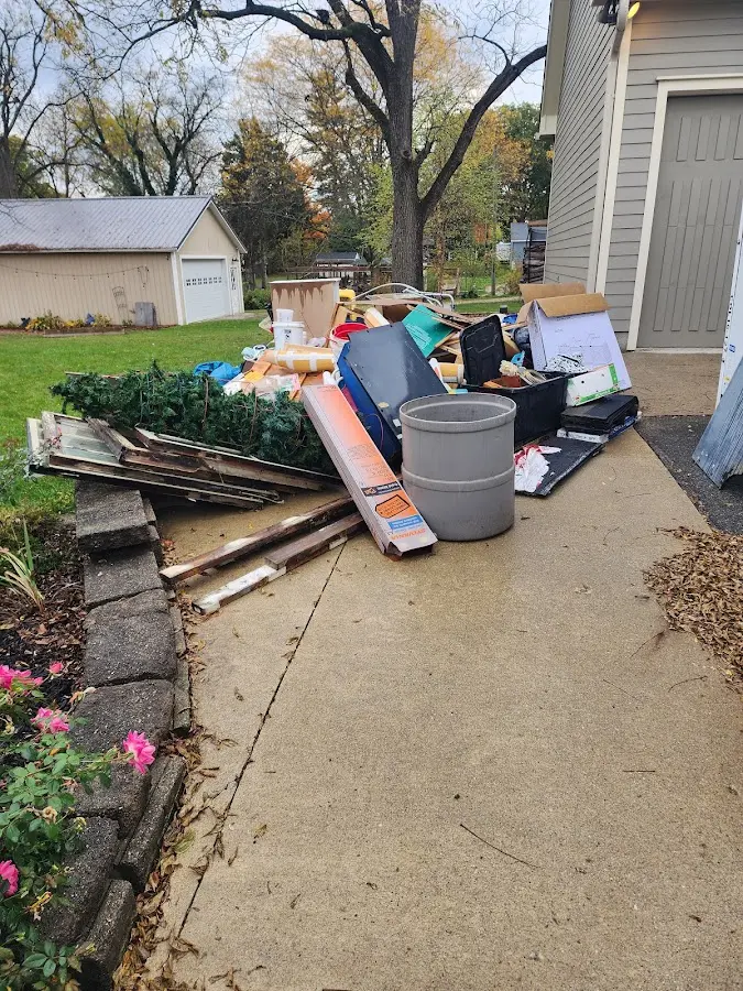 Dumpster being loaded with debris for 3 Yard Dumpster Rental in Sudbury
